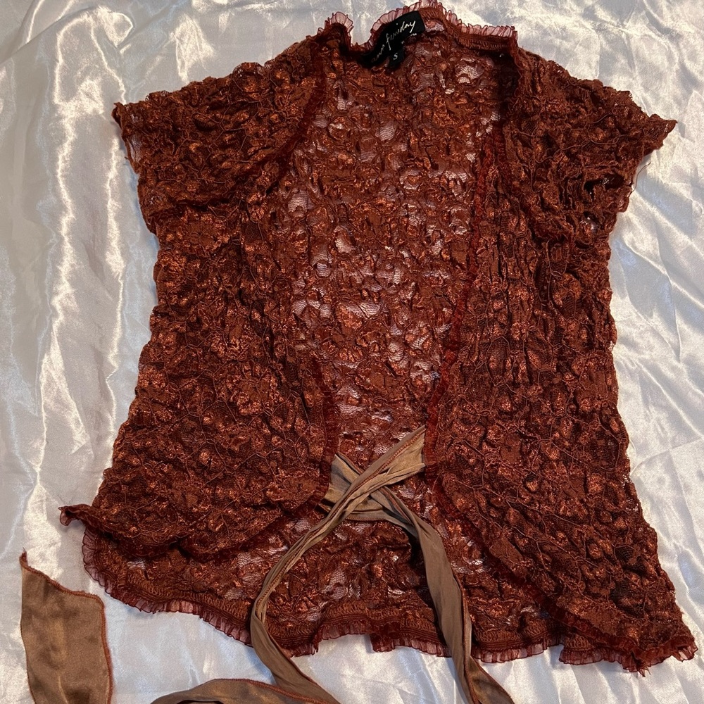 cardigan with tie in front. floral lace pattern/fabric